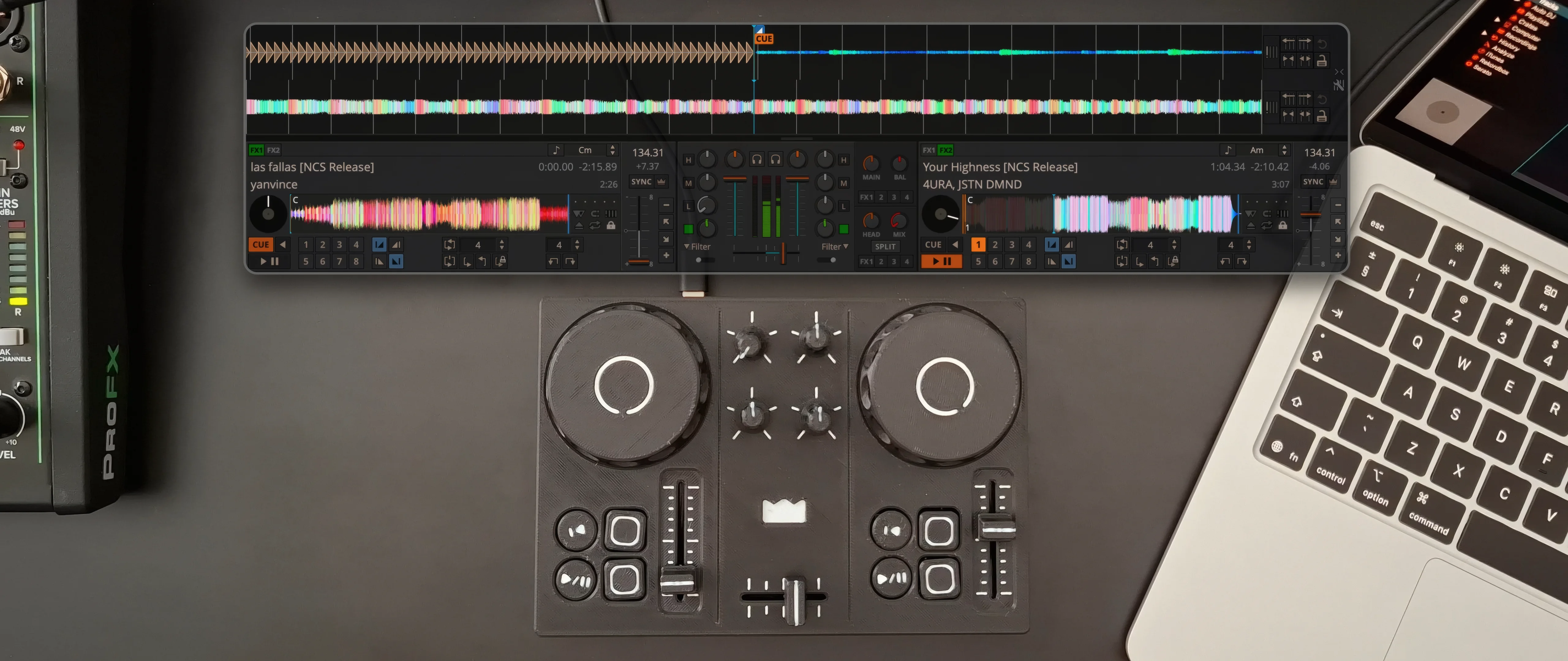 Top view of the 3D printed DJC-DIY controller on a desk, with the Mixxx DJ software shown above it and a laptop beside it